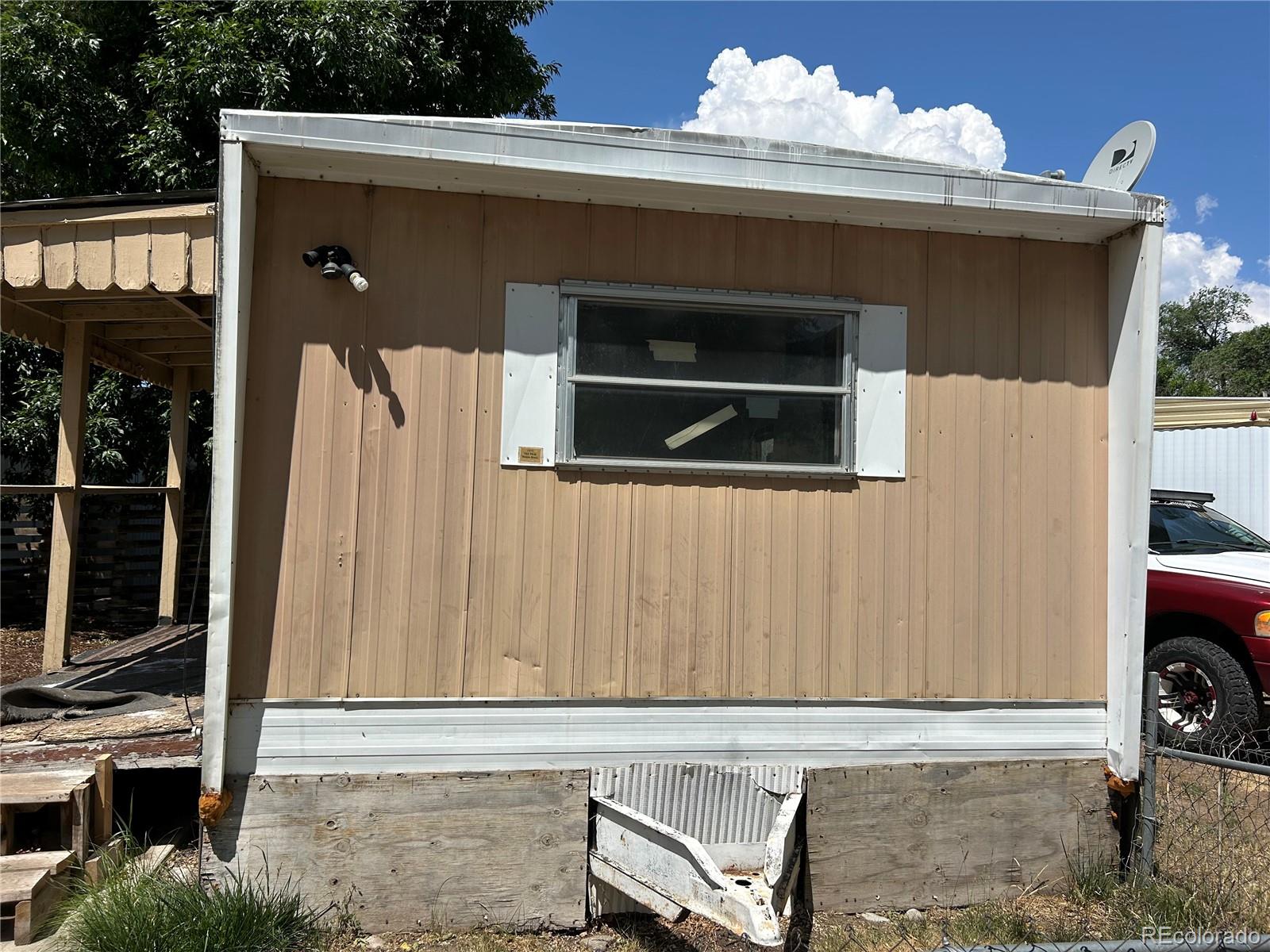 226 Scott Street Salida, CO 81201 - Photo 3 of 15 a front view of a house with entryway