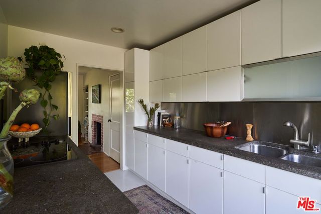 a kitchen with cabinets a sink and a counter top space