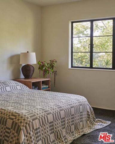 a view of a hallway with a wooden floor