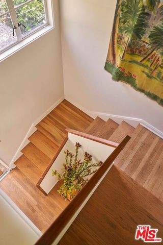 a view of a chairs and table in backyard