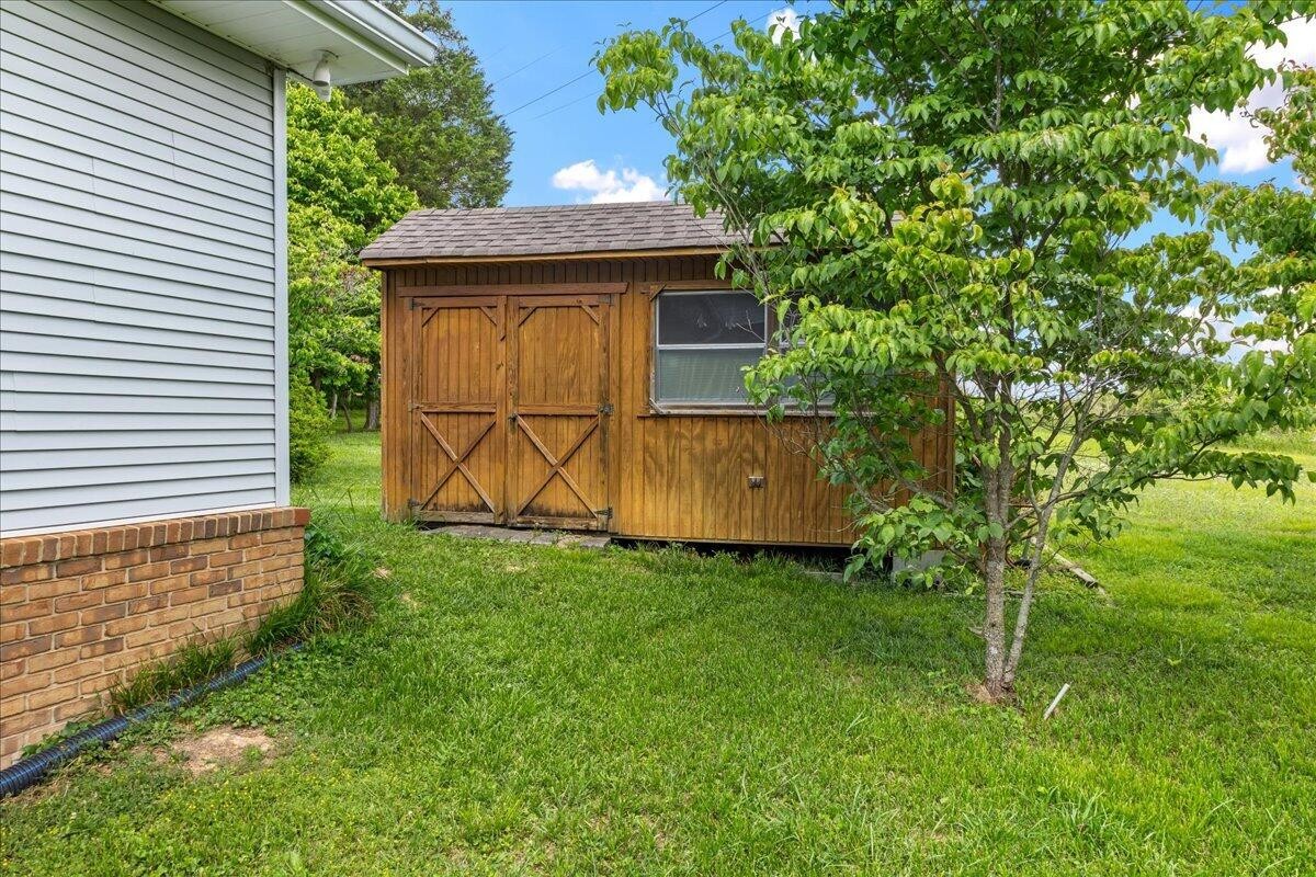 2522 Cindy Street Athens, TN 37303 - Photo 34 of 36 a view of a backyard with a garden