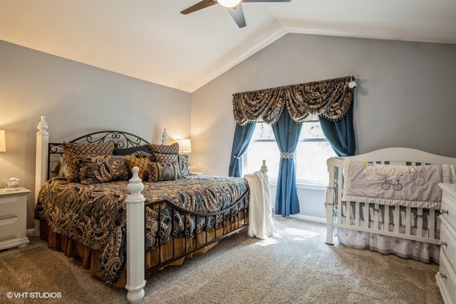 5426 Cloverdale Road Hanover Park, IL 60133 - Photo 11 of 22 a bedroom with a bed next to a window