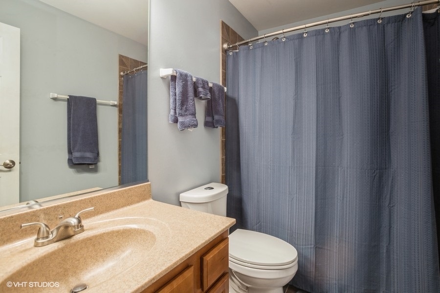 5426 Cloverdale Road Hanover Park, IL 60133 - Photo 15 of 22 a bathroom with a sink toilet and shower