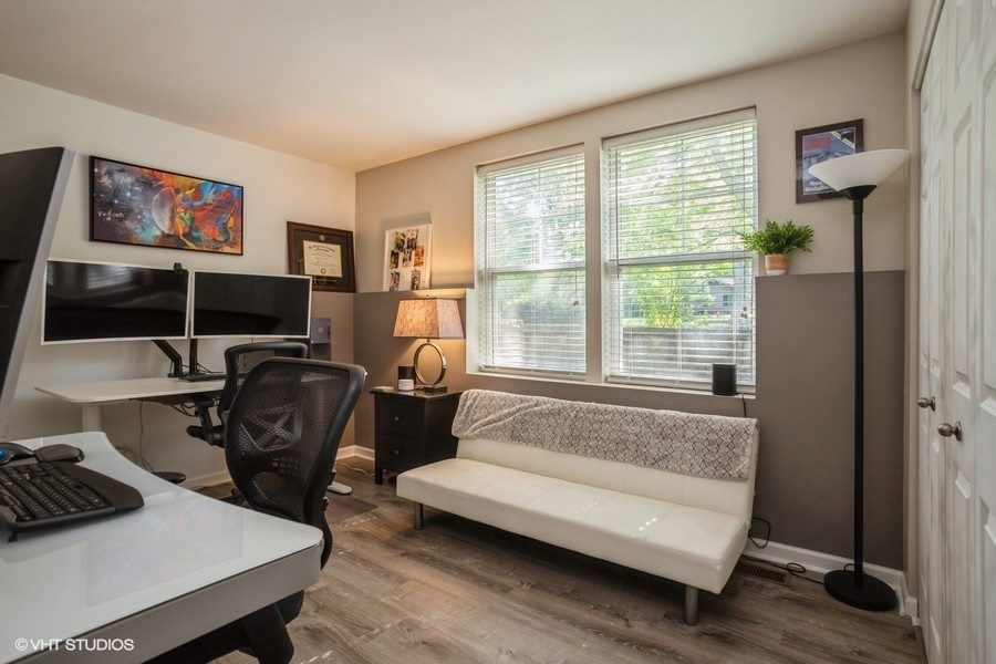 5426 Cloverdale Road Hanover Park, IL 60133 - Photo 16 of 22 a living room with furniture and a window