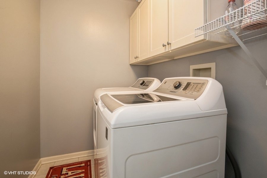 5426 Cloverdale Road Hanover Park, IL 60133 - Photo 18 of 22 a utility room with dryer and washer