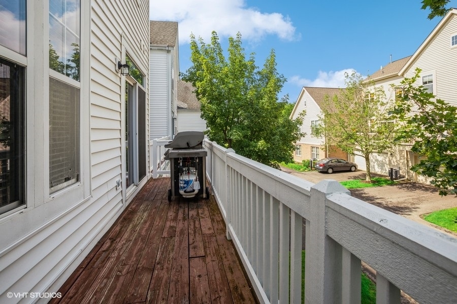 5426 Cloverdale Road Hanover Park, IL 60133 - Photo 20 of 22 a view of a balcony with wooden floor and outdoor space
