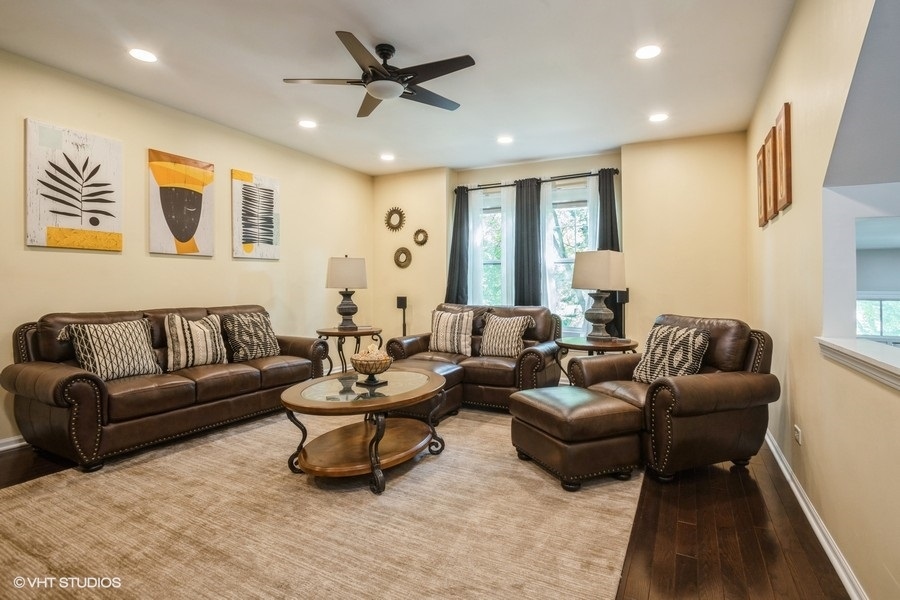 5426 Cloverdale Road Hanover Park, IL 60133 - Photo 4 of 22 a living room with furniture and a large window