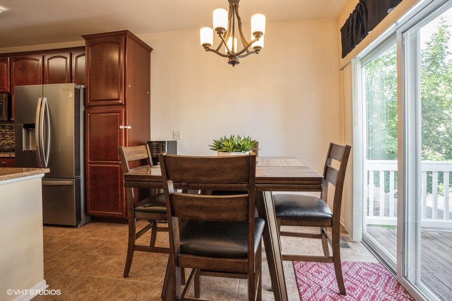 5426 Cloverdale Road Hanover Park, IL 60133 - Photo 7 of 22 a view of a dining room with furniture window and outside view