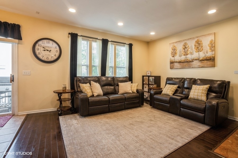 5426 Cloverdale Road Hanover Park, IL 60133 - Photo 8 of 22 a living room with furniture and a large window