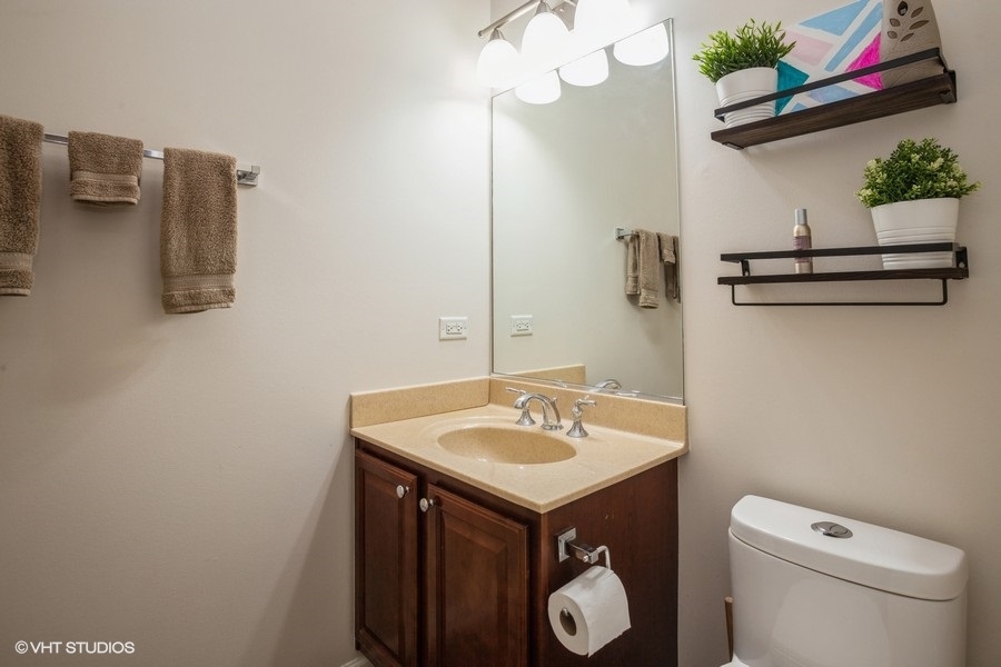 5426 Cloverdale Road Hanover Park, IL 60133 - Photo 10 of 22 a bathroom with a sink and a toilet