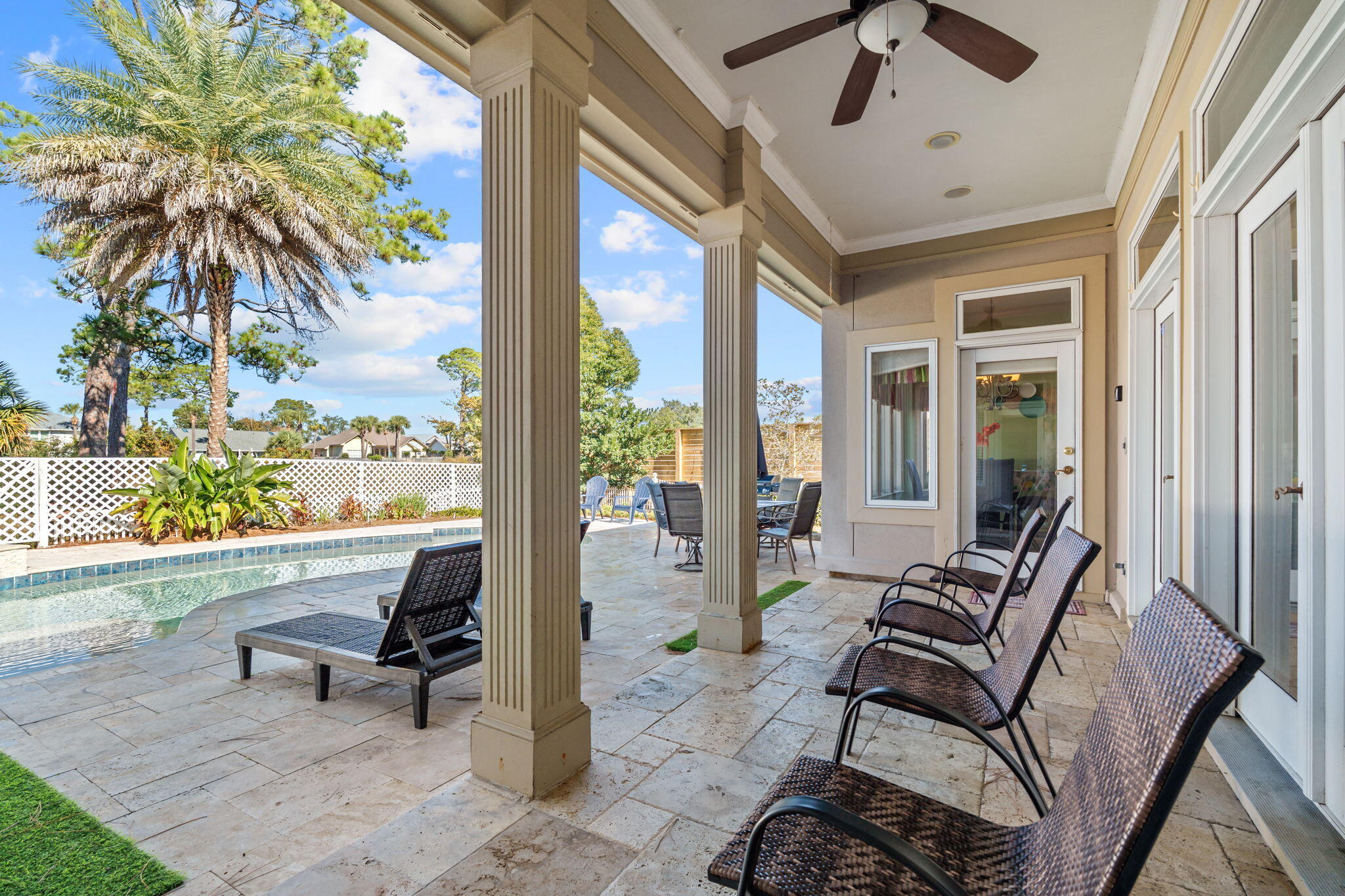 322 Wahoo Road Panama City Beach, FL 32408 - Photo 11 of 57 a balcony with furniture and a potted plant