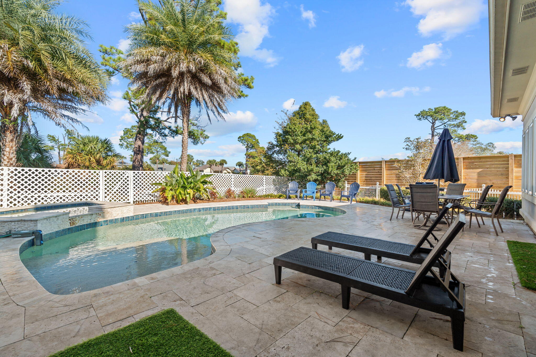 322 Wahoo Road Panama City Beach, FL 32408 - Photo 12 of 57 a view of swimming pool with outdoor seating and plants