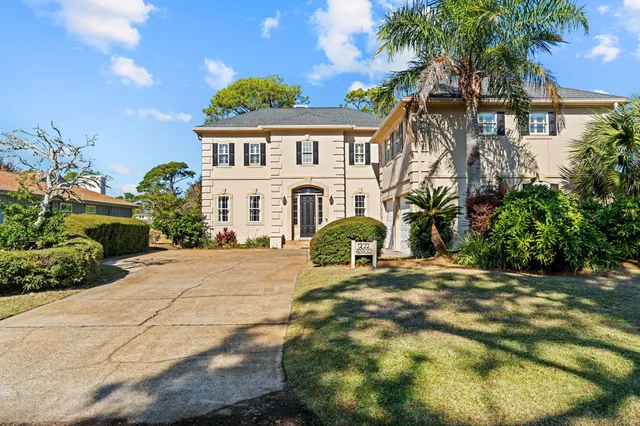a front view of a house with yard