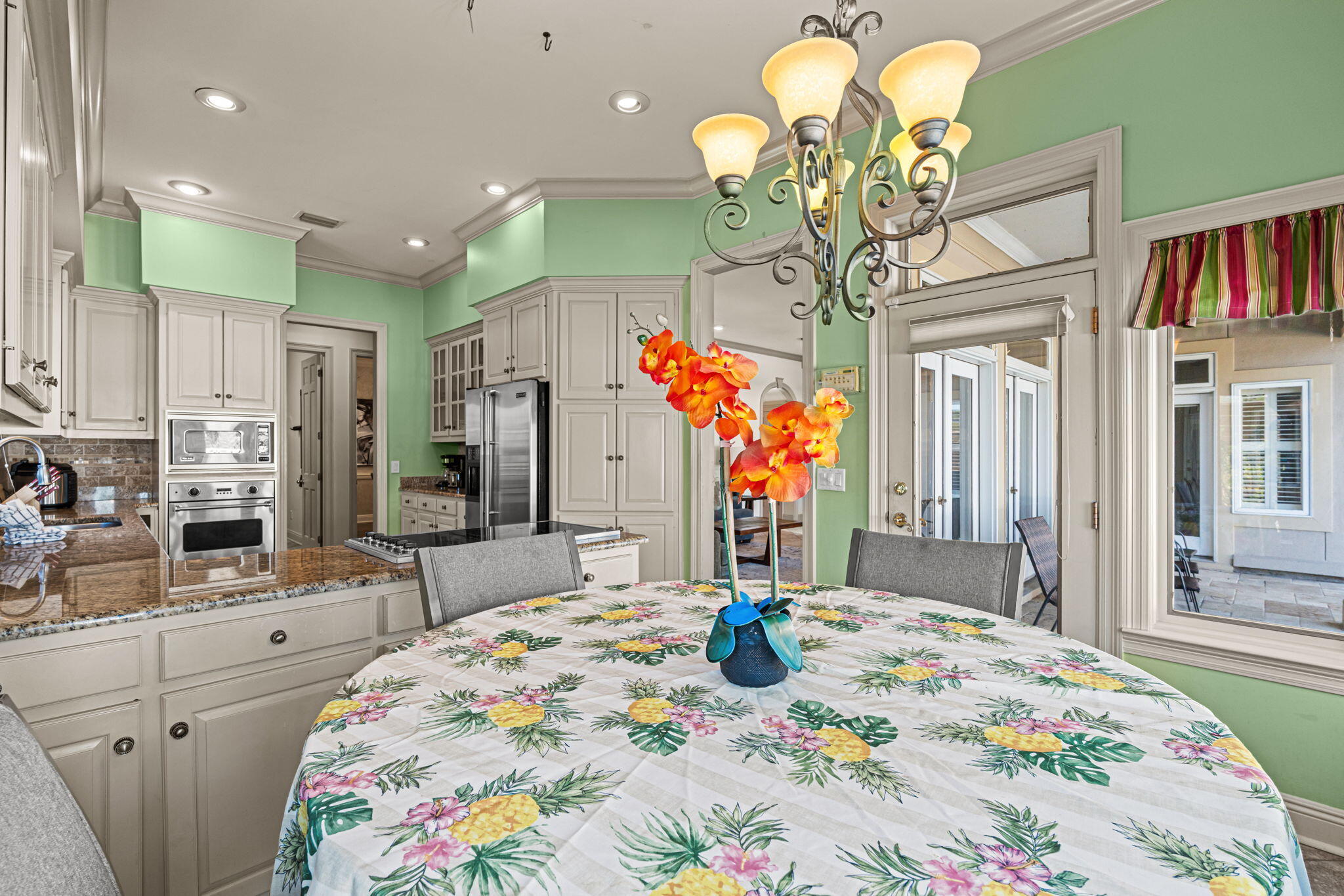 322 Wahoo Road Panama City Beach, FL 32408 - Photo 23 of 57 a bedroom with bed and a chandelier