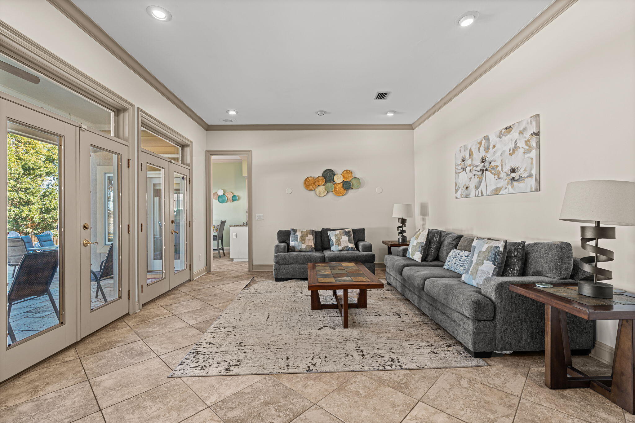 322 Wahoo Road Panama City Beach, FL 32408 - Photo 25 of 57 a living room with furniture and a table