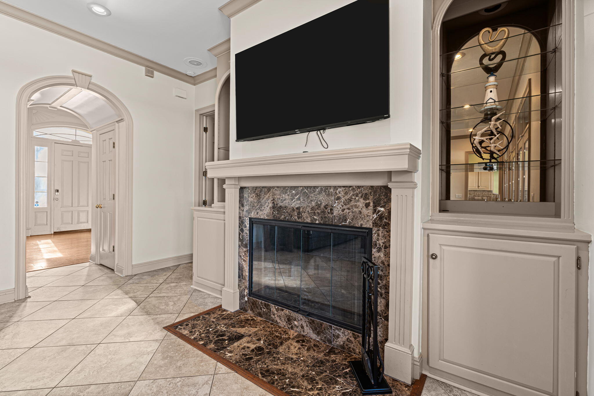 322 Wahoo Road Panama City Beach, FL 32408 - Photo 27 of 57 a living room with a fireplace and a flat screen tv