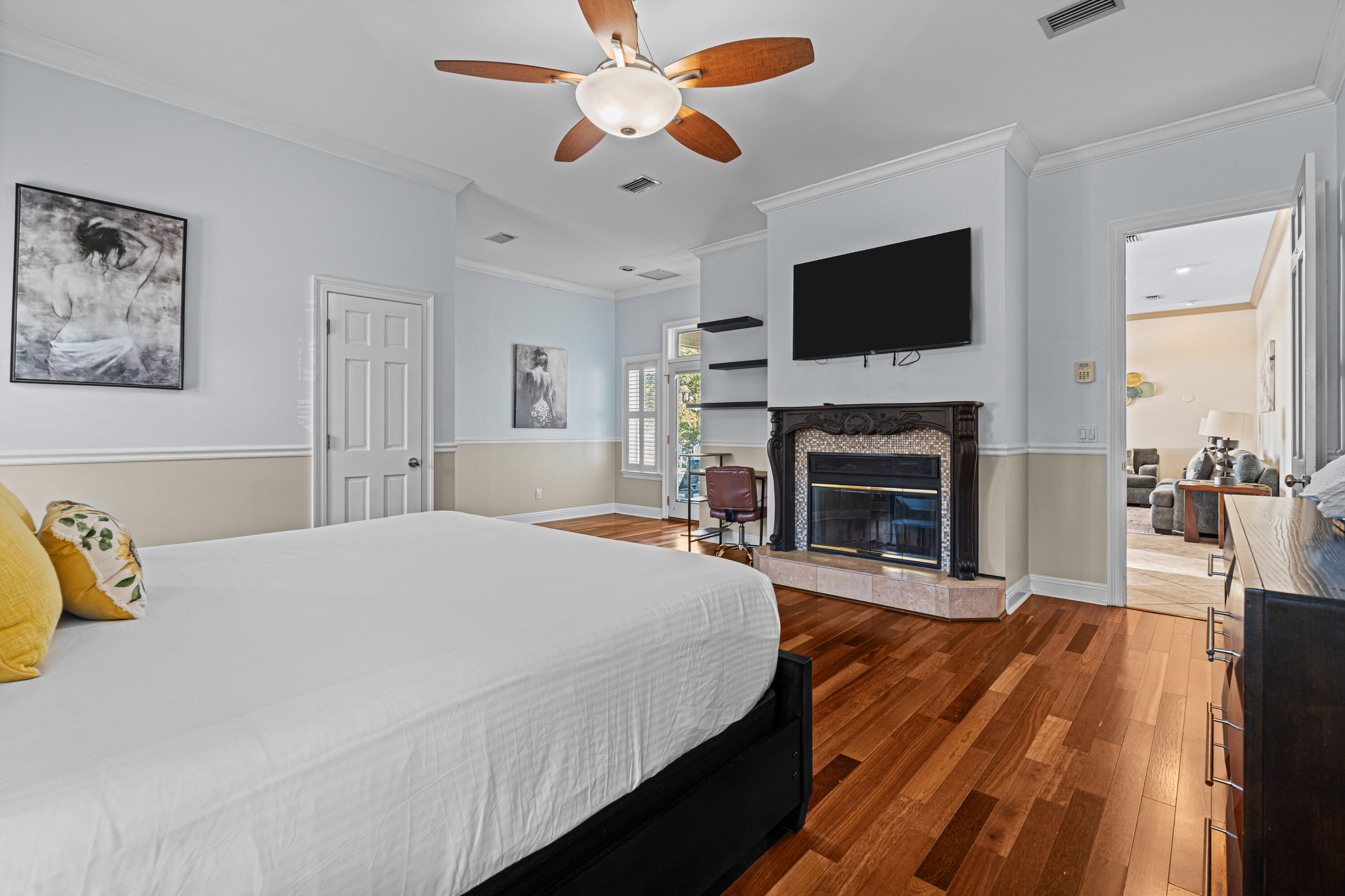 322 Wahoo Road Panama City Beach, FL 32408 - Photo 30 of 57 a bedroom with a bed and a flat screen tv