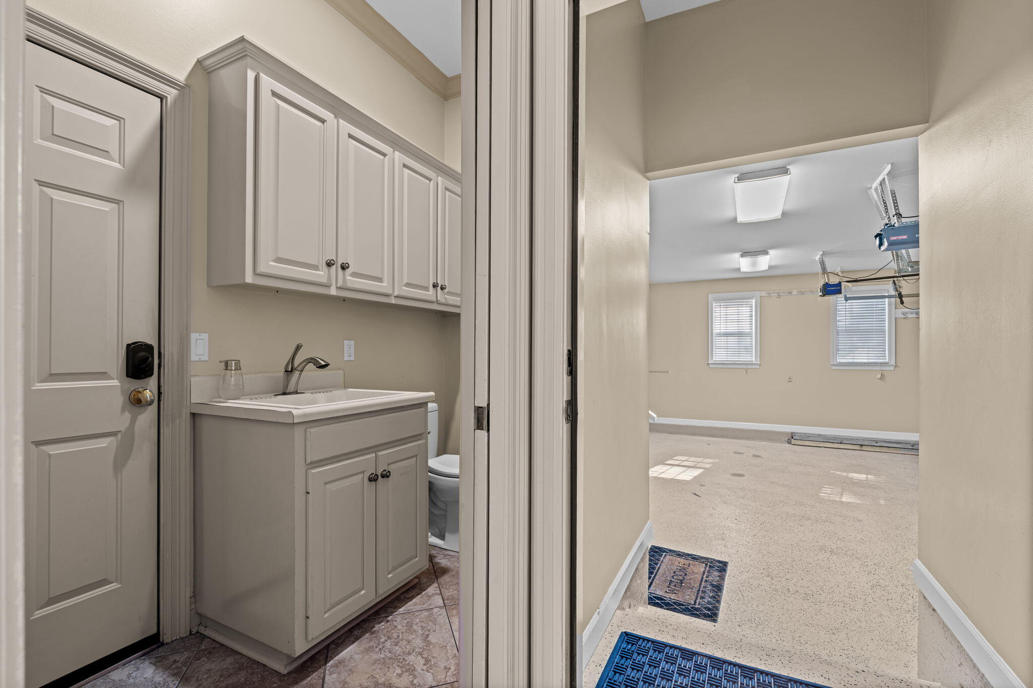 322 Wahoo Road Panama City Beach, FL 32408 - Photo 35 of 38 a bathroom with a sink and mirror with shower