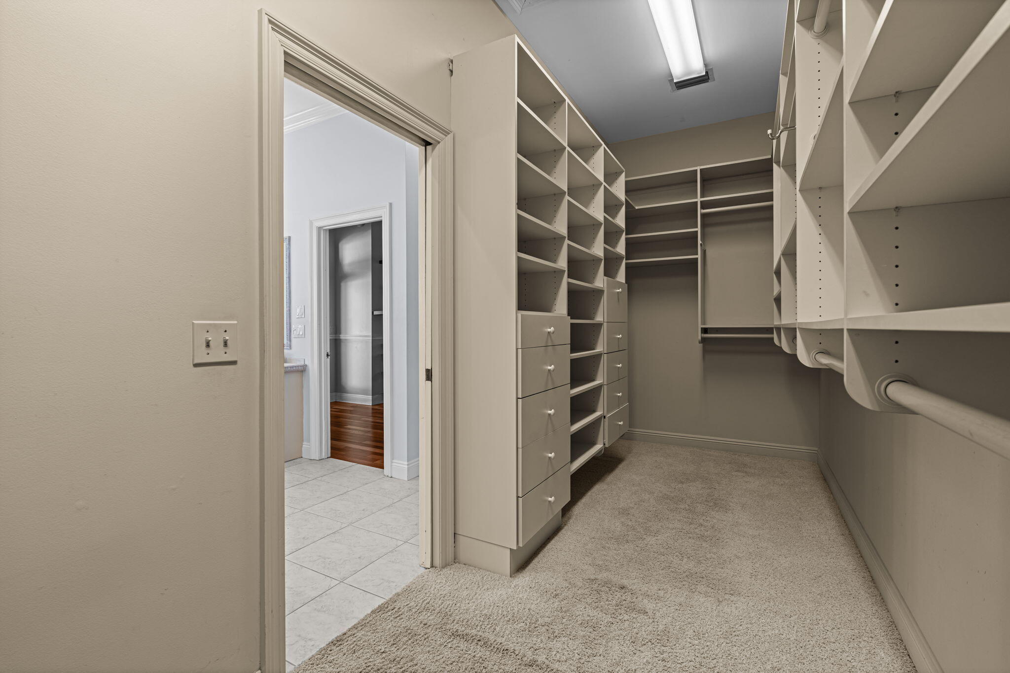322 Wahoo Road Panama City Beach, FL 32408 - Photo 35 of 57 a view of walk in closet with empty racks