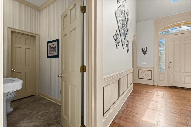 a view of a room with wooden floor and staircase
