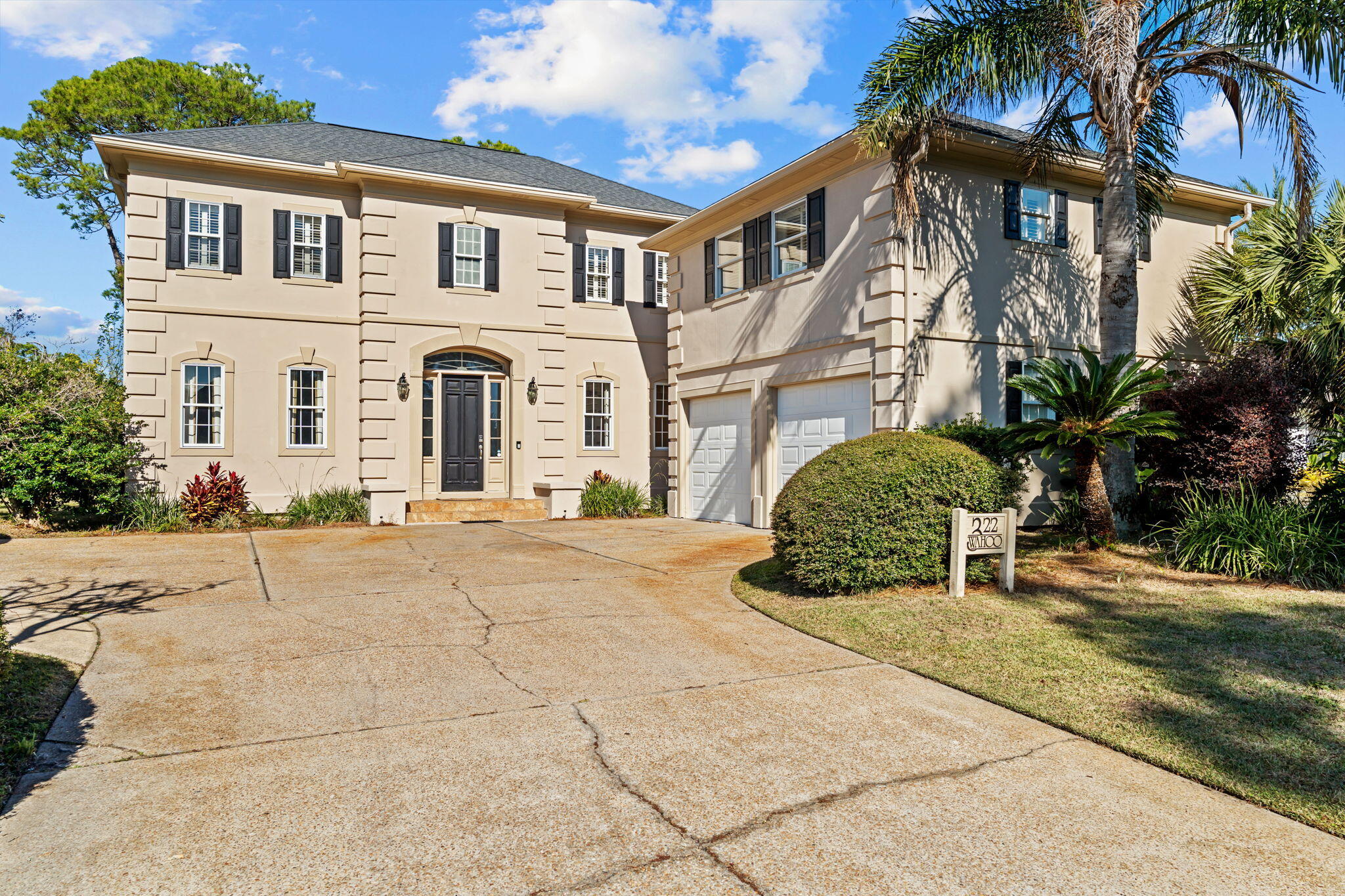 322 Wahoo Road Panama City Beach, FL 32408 - Photo 4 of 57 a front view of a house with a yard