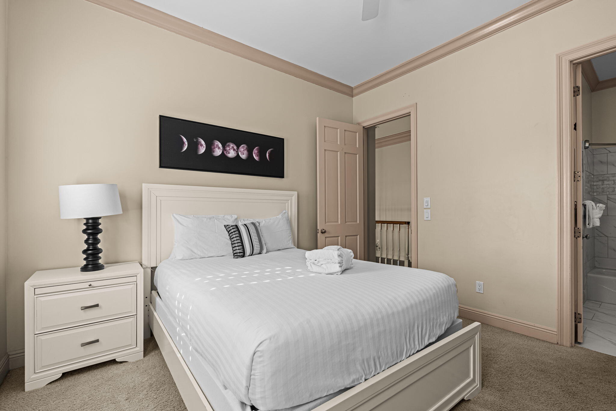 322 Wahoo Road Panama City Beach, FL 32408 - Photo 44 of 57 a bedroom with a bed and a night stand