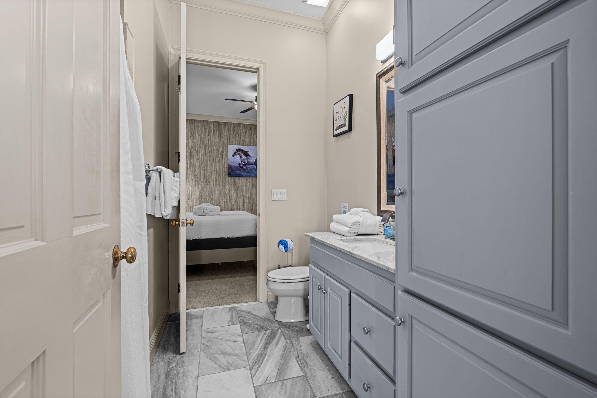 322 Wahoo Road Panama City Beach, FL 32408 - Photo 51 of 57 a en suite bathroom with a granite countertop sink and a mirror