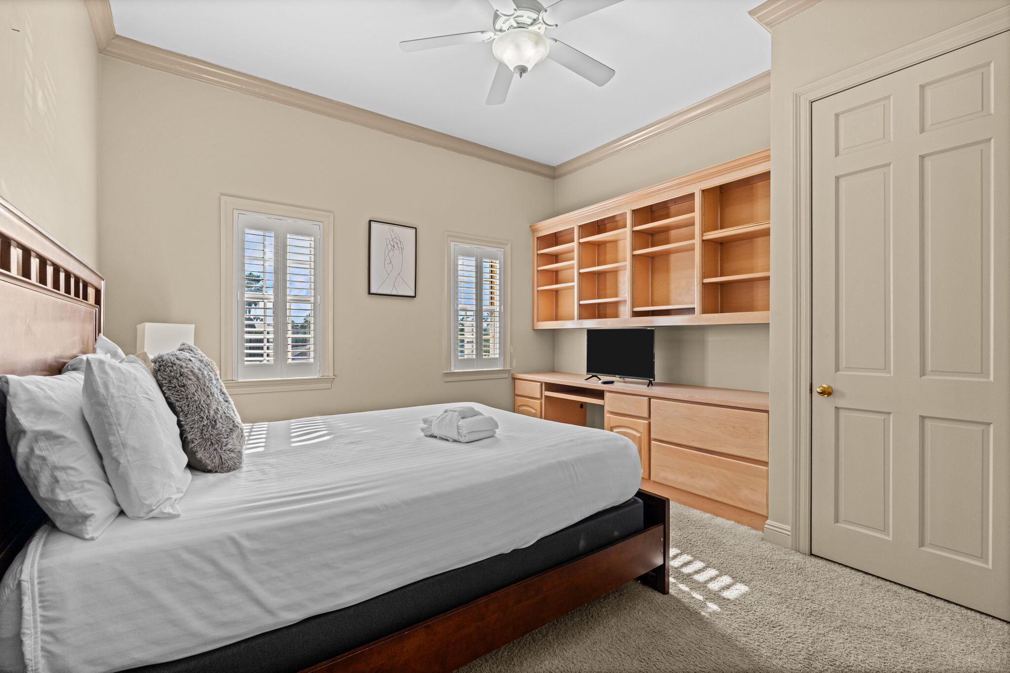 322 Wahoo Road Panama City Beach, FL 32408 - Photo 53 of 57 a bedroom with a bed and a chandelier