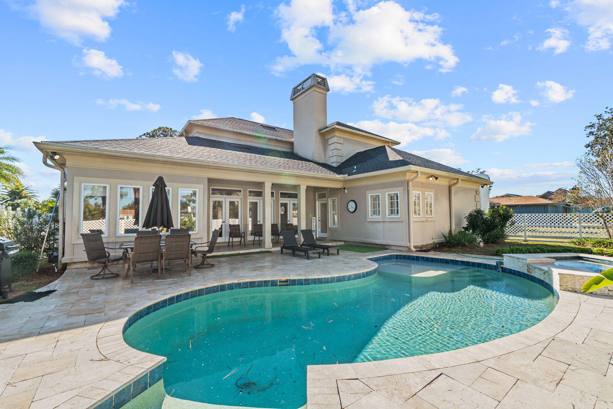 322 Wahoo Road Panama City Beach, FL 32408 - Photo 6 of 57 a view of a house with swimming pool and sitting area