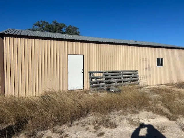 a view of a outdoor space with wooden fence