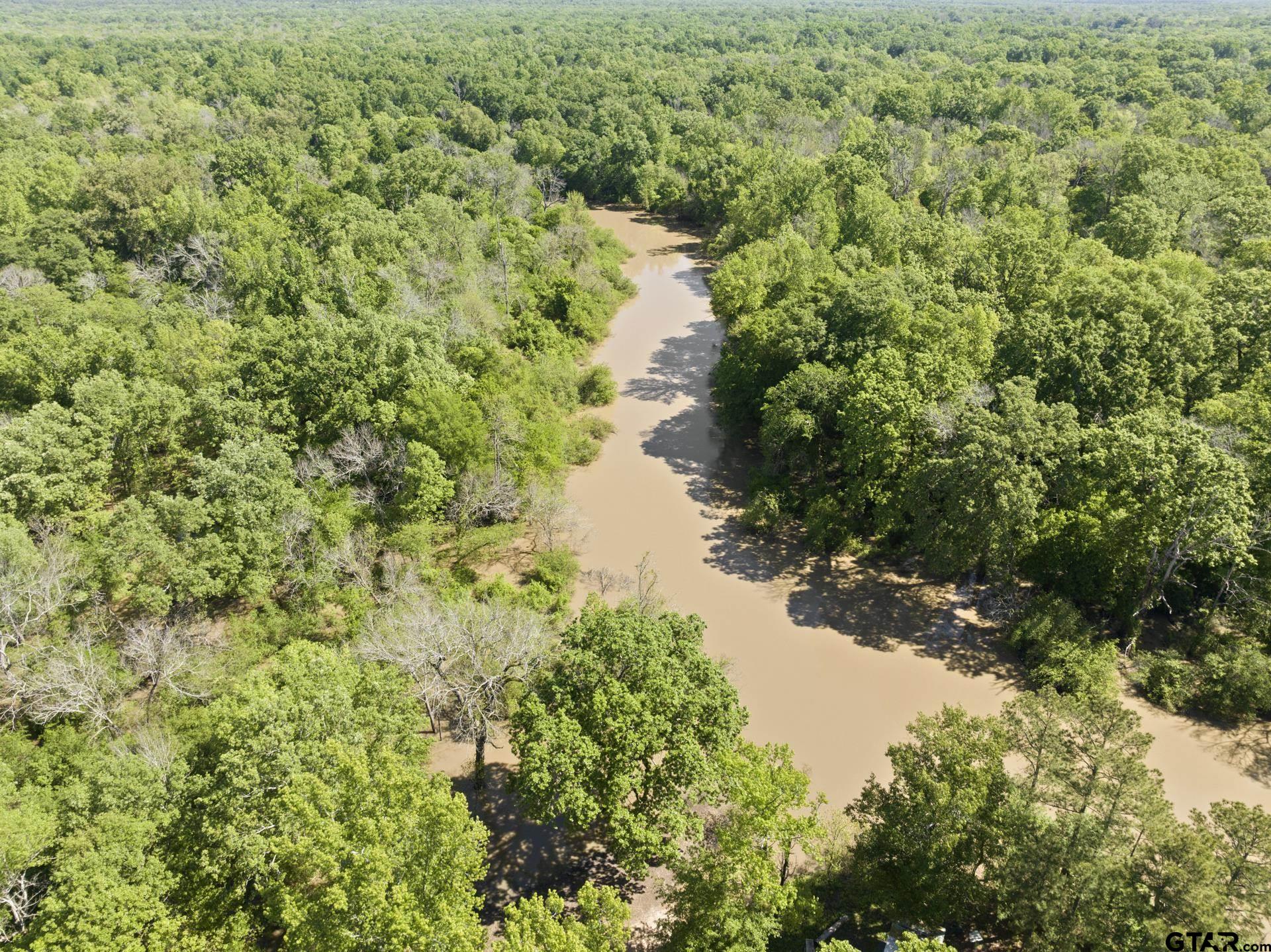 307 Fish Trap Lane Naples, TX 75568 - Photo 21 of 41 a view of a lake with a house