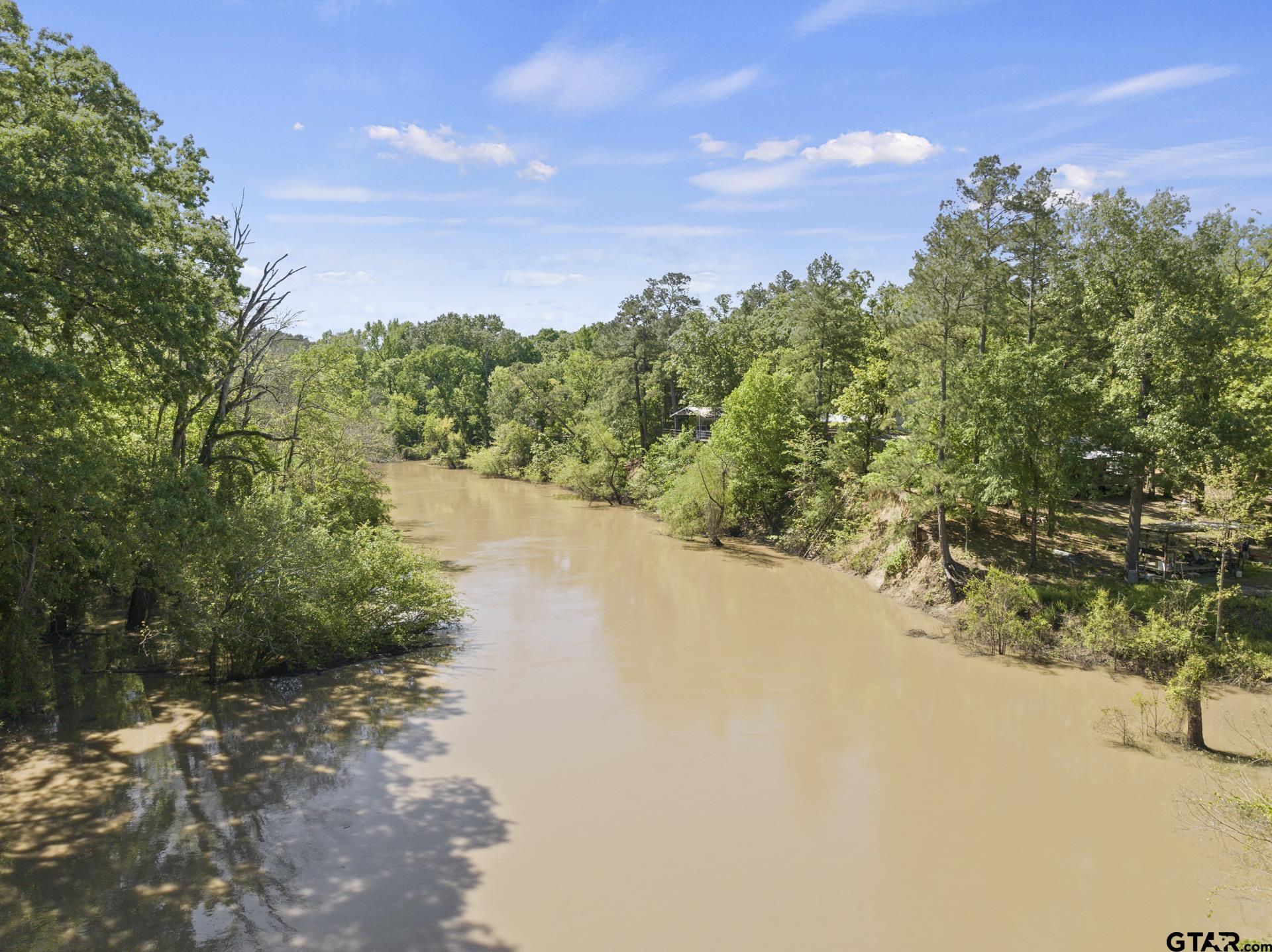 307 Fish Trap Lane Naples, TX 75568 - Photo 23 of 41 a view of a lake with a mountain in the background