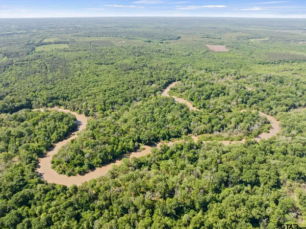 a view of a field with an outdoor space