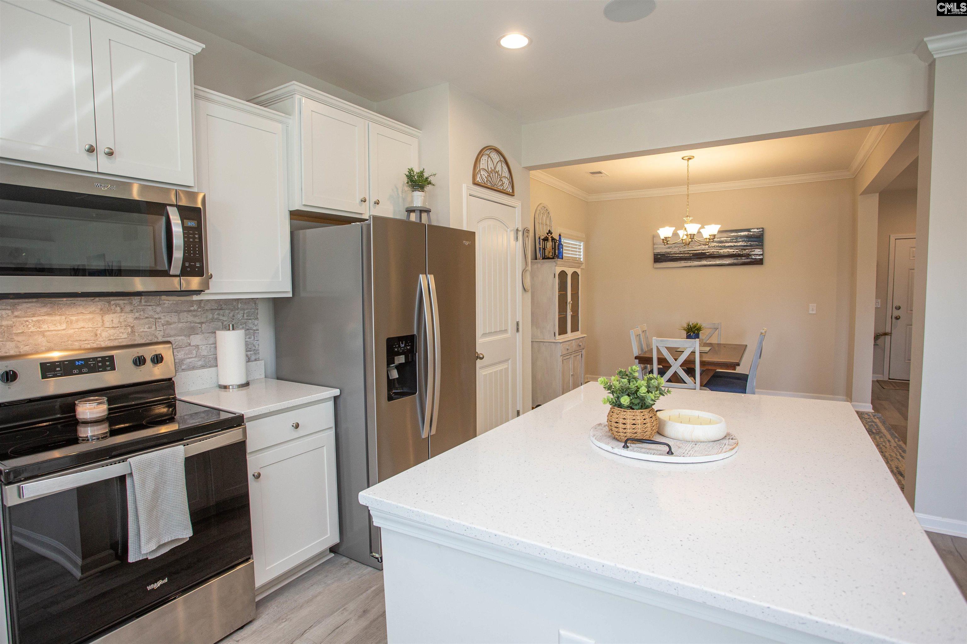 272 Shadowbrook Way Camden, SC 29020 - Photo 12 of 43 a kitchen with a sink a stove and refrigerator