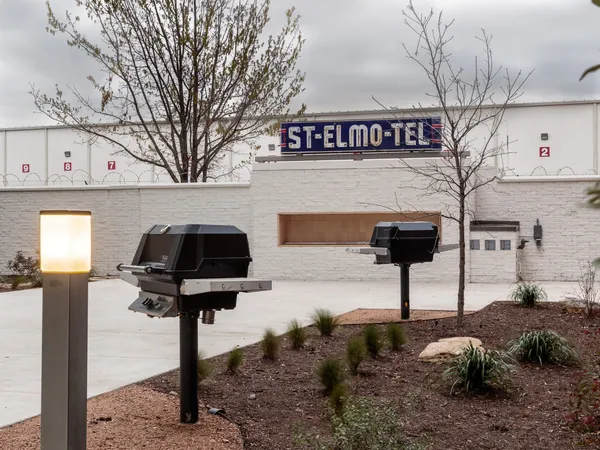 a front view of a house with parking area