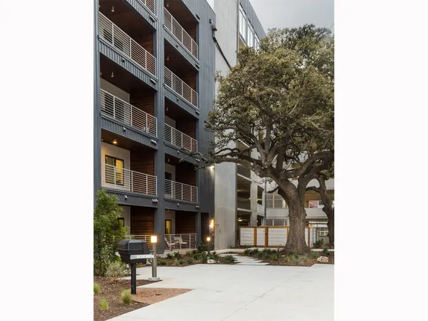 a tall building sitting in front of a building