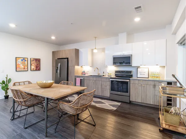 a kitchen with a table and chairs in it