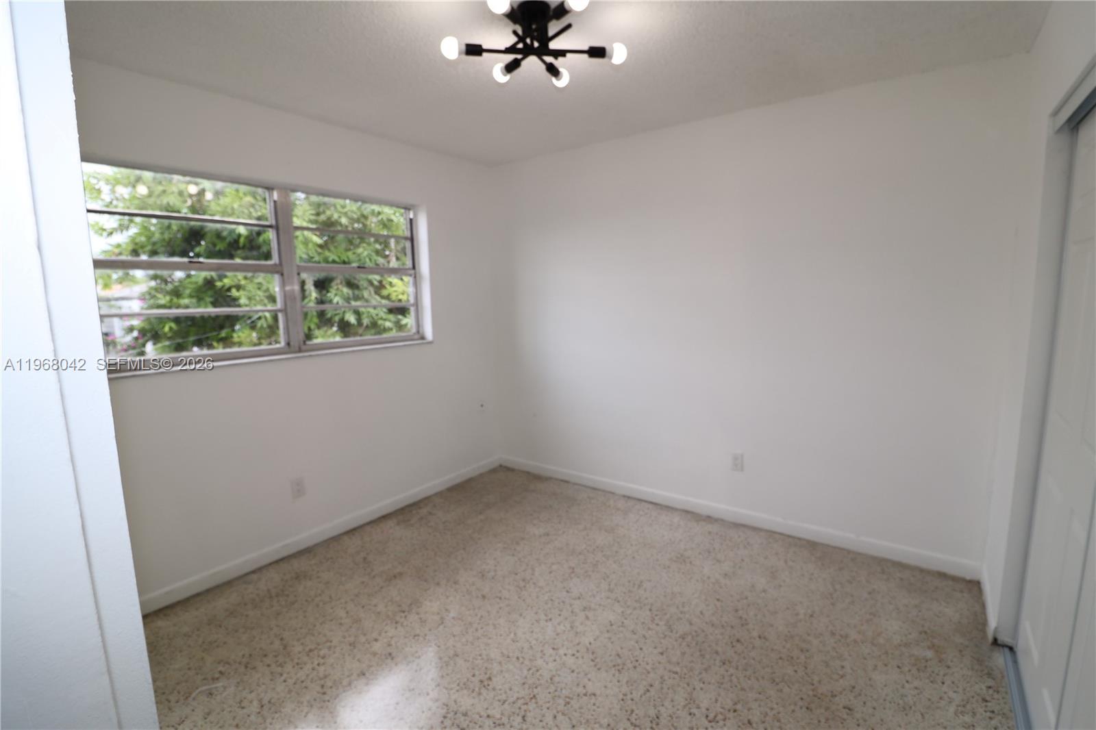 951 Southwest 7th Street, Unit 5 Miami, FL 33130 - Photo 11 of 23 an empty room with a window