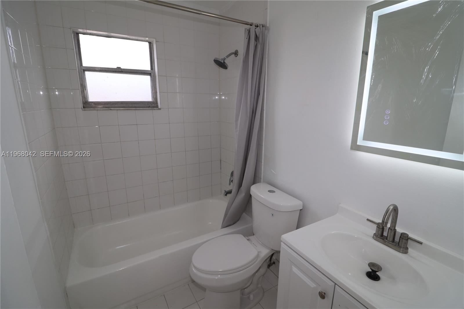 951 Southwest 7th Street, Unit 5 Miami, FL 33130 - Photo 14 of 23 a bathroom with a sink toilet and shower