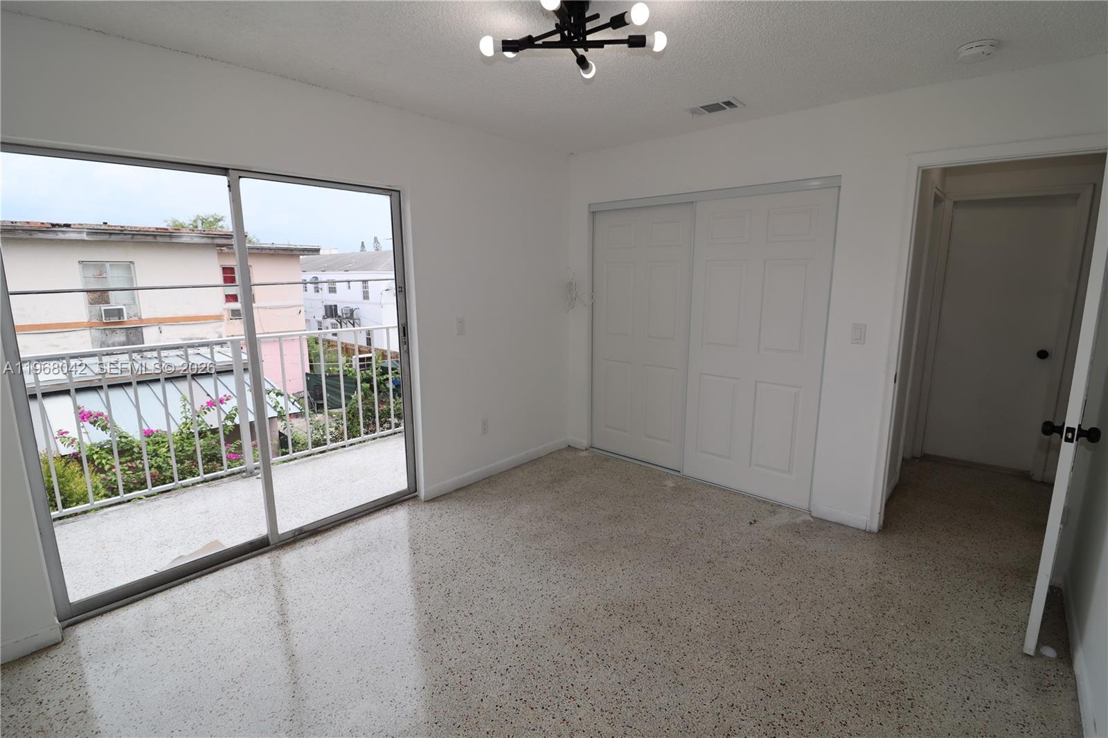 951 Southwest 7th Street, Unit 5 Miami, FL 33130 - Photo 16 of 23 a view of a room with a floor to ceiling window and an entryway