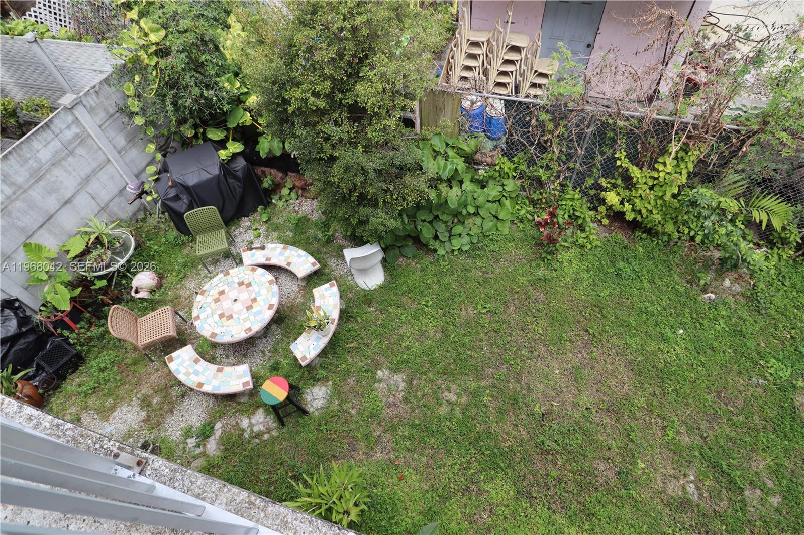 951 Southwest 7th Street, Unit 5 Miami, FL 33130 - Photo 21 of 23 a view of a table with chairs in patio
