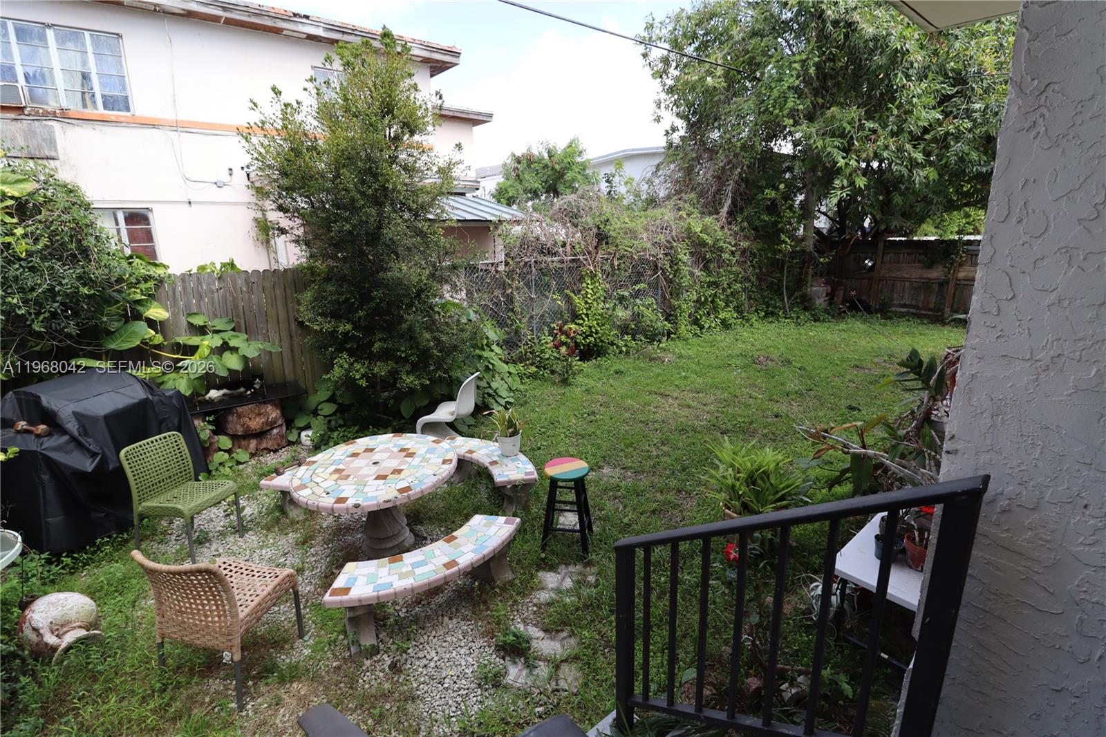 951 Southwest 7th Street, Unit 5 Miami, FL 33130 - Photo 22 of 23 a view of balcony with furniture and garden