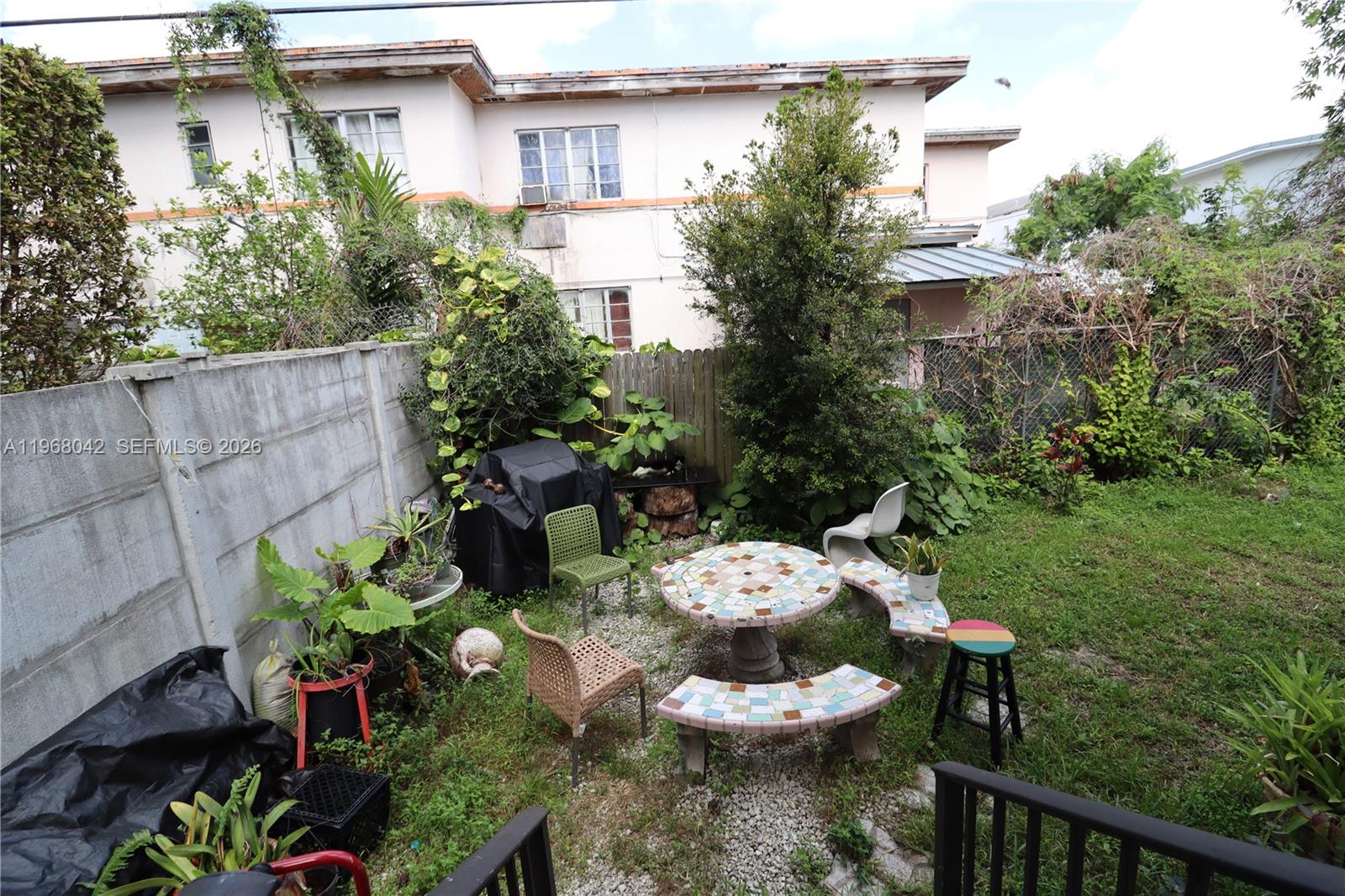 951 Southwest 7th Street, Unit 5 Miami, FL 33130 - Photo 23 of 23 a view of a porch with chairs and a potted plant