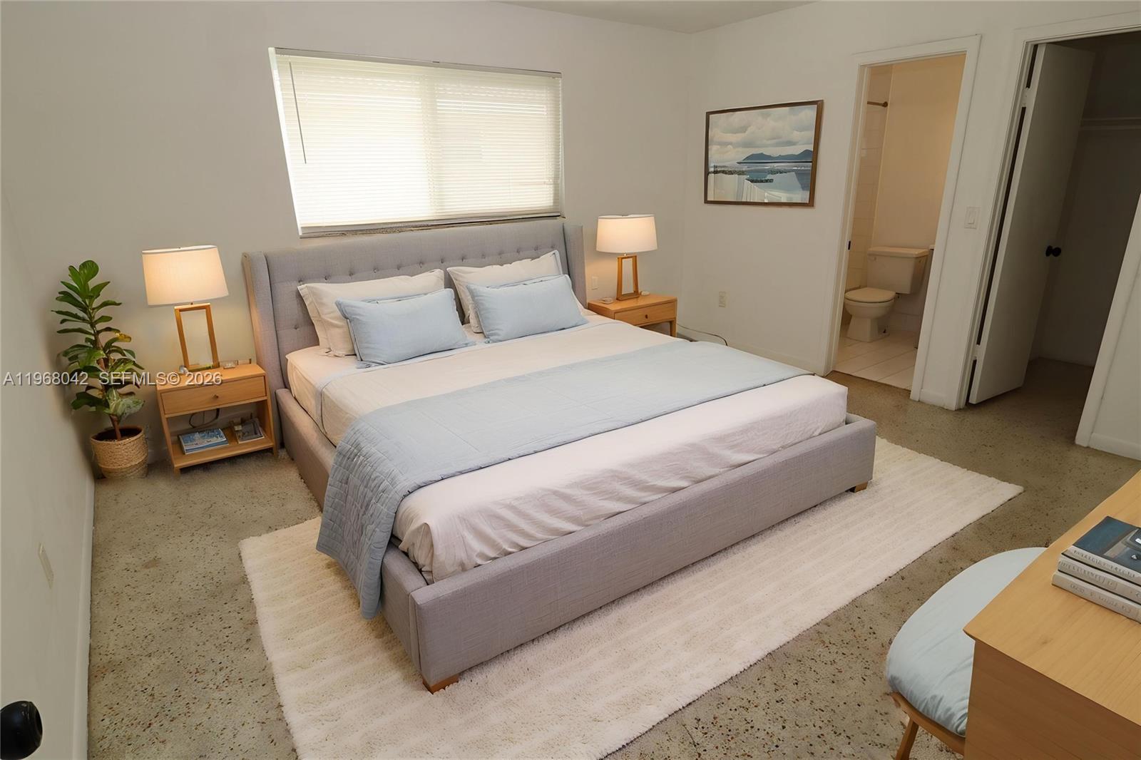 951 Southwest 7th Street, Unit 5 Miami, FL 33130 - Photo 4 of 23 a bedroom with a bed and a night stand