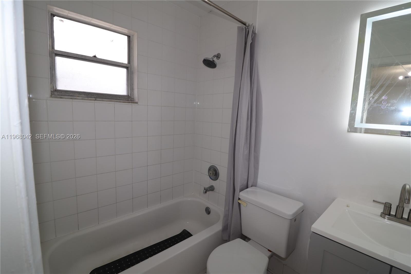 951 Southwest 7th Street, Unit 5 Miami, FL 33130 - Photo 7 of 23 a bathroom with a toilet and a bathtub
