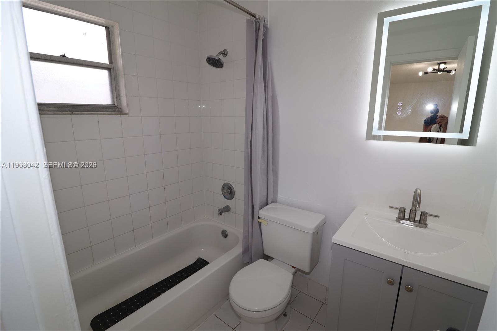 951 Southwest 7th Street, Unit 5 Miami, FL 33130 - Photo 8 of 23 a bathroom with a toilet a sink and bathtub