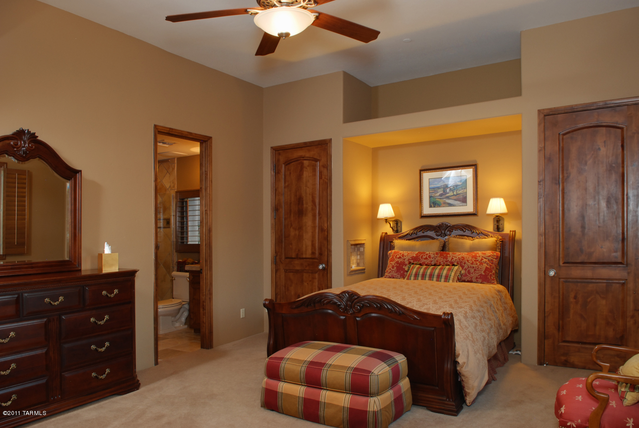 2188 East Buck Ridge Place Oro Valley, AZ 85737 - Photo 17 of 22 a bedroom with a bed and a dresser