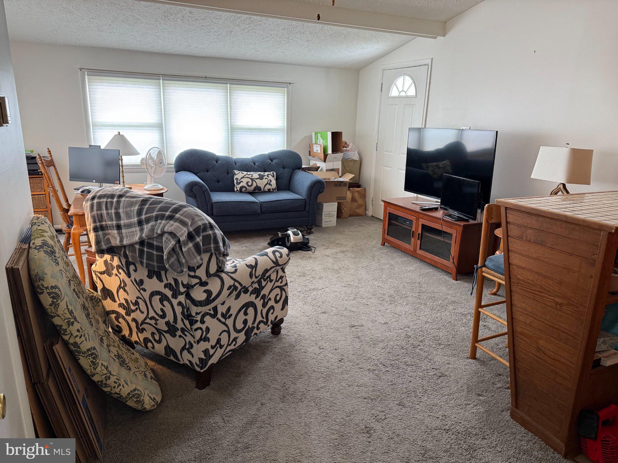 6117 Auth Road Suitland, MD 20746 - Photo 2 of 7 a living room with furniture window and a flat screen tv