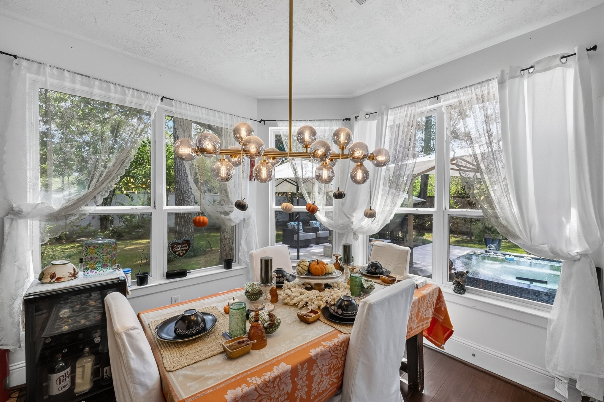 335 Voss Road Houston, TX 77024 - Photo 17 of 50 Charming breakfast area surrounded by picturesque backyard and pool view.