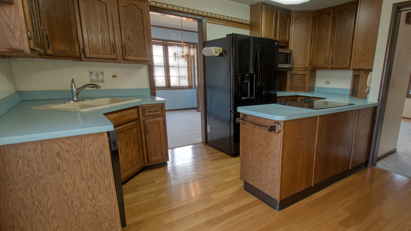 1200 Ridgeway Drive Elgin, IL 60123 - Photo 13 of 34 a kitchen with stainless steel appliances granite countertop a refrigerator a sink and a stove